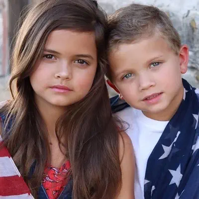 Zoey Merchant with her father and brother